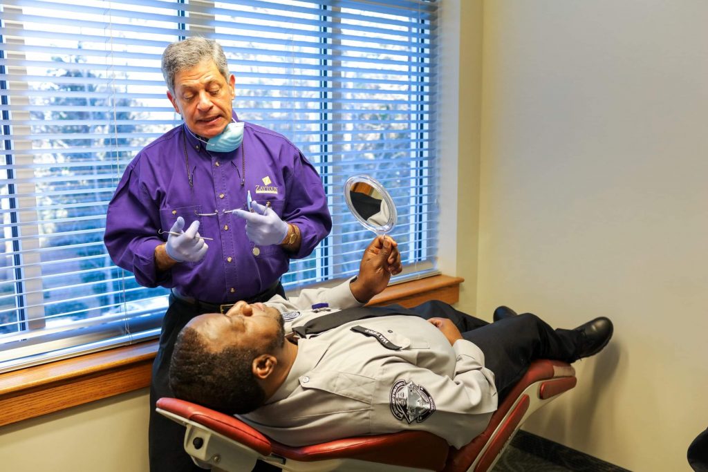 Patient in chair with doctor